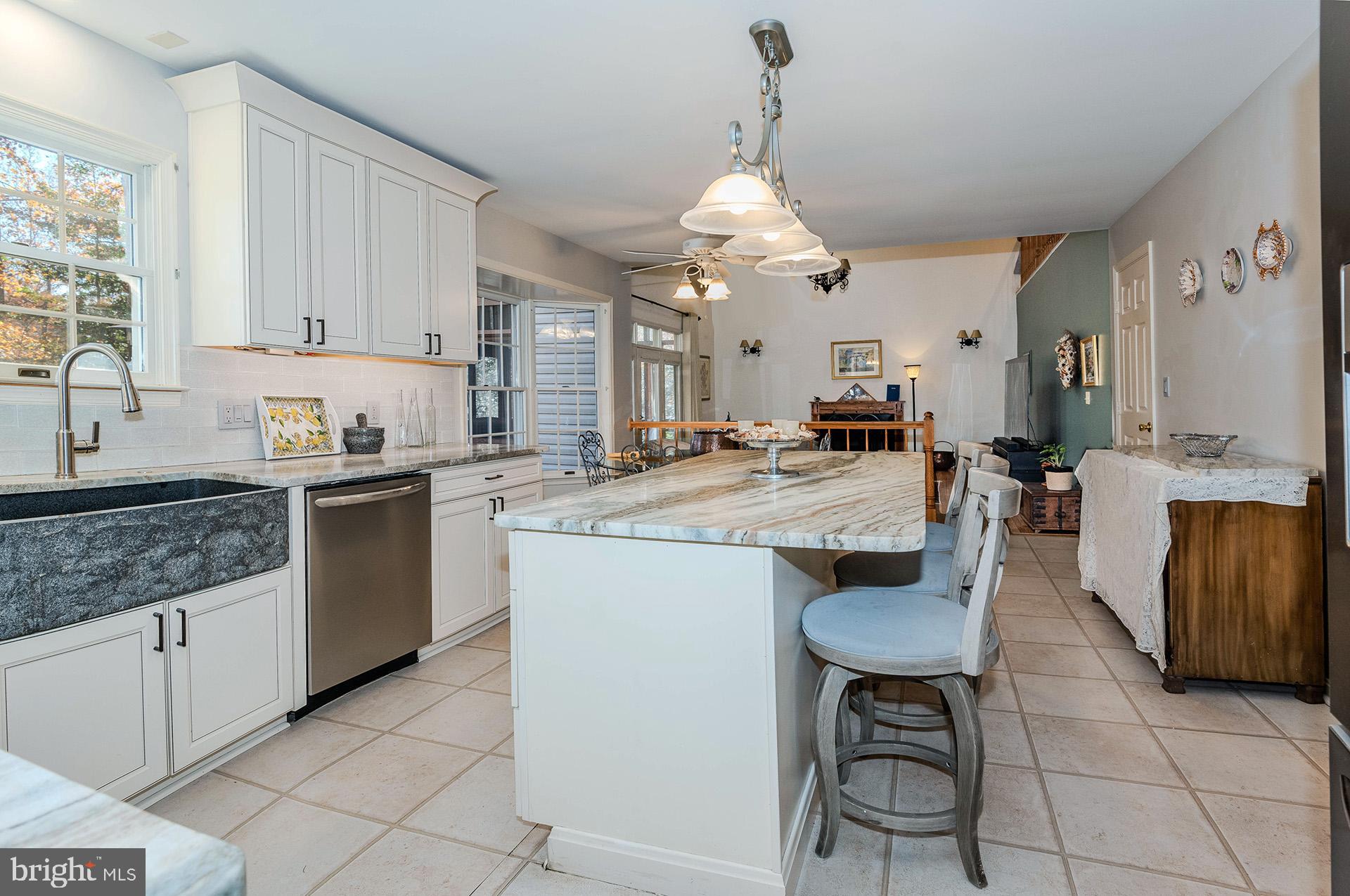 621 Wood Lot Trail Road Annapolis, MD 21401 - Photo 17 of 44 a kitchen with stainless steel appliances granite countertop a sink a stove and cabinets