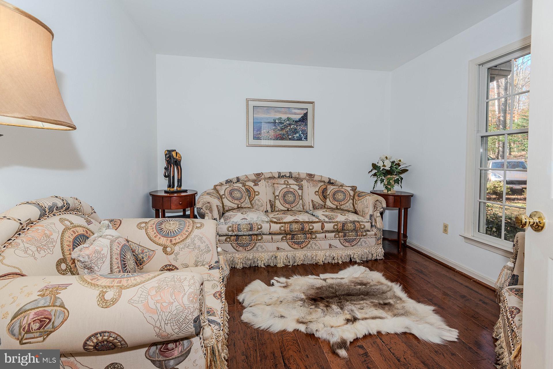 621 Wood Lot Trail Road Annapolis, MD 21401 - Photo 19 of 44 a bedroom with a bed and wooden floor