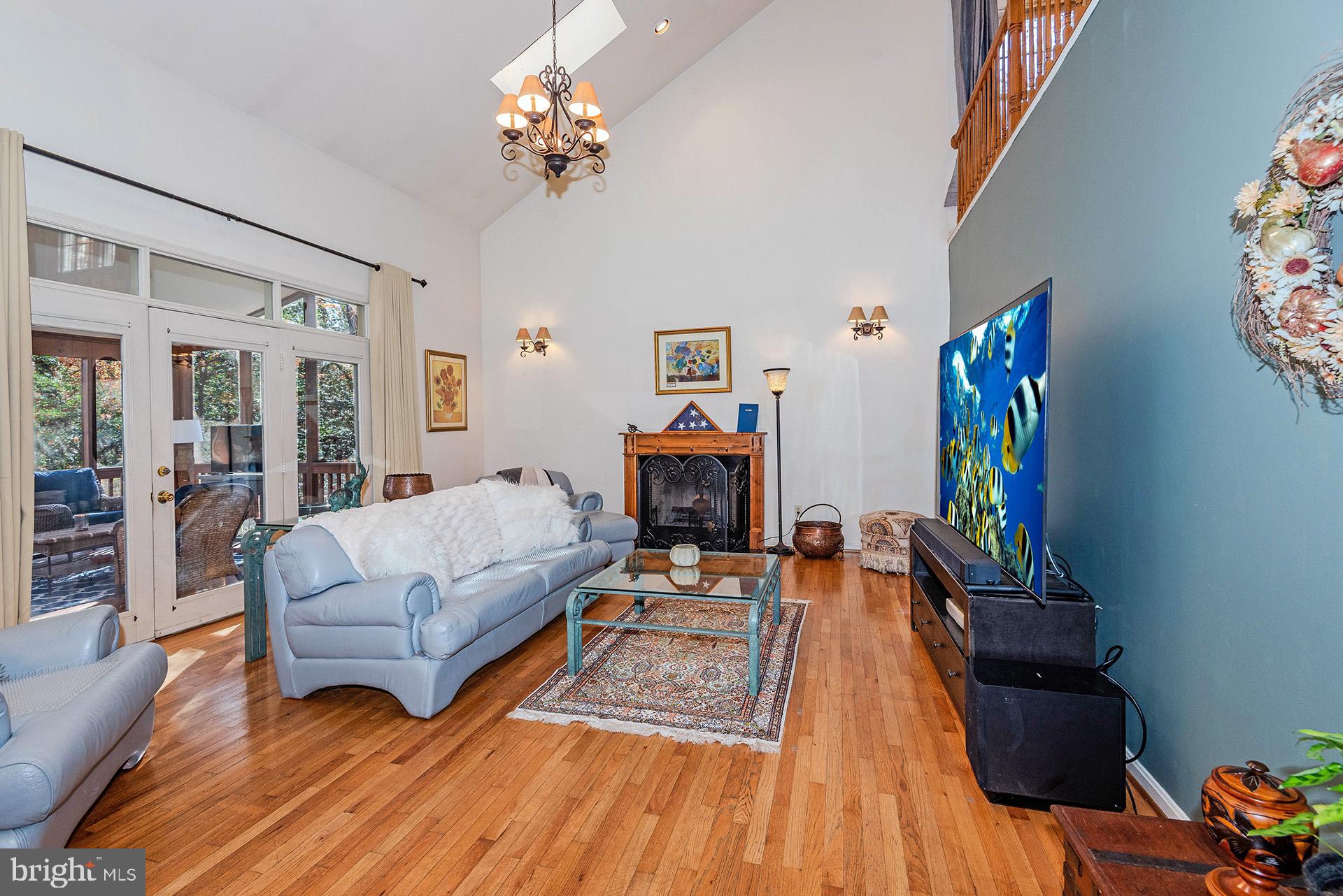 621 Wood Lot Trail Road Annapolis, MD 21401 - Photo 20 of 44 a living room with furniture and a flat screen tv