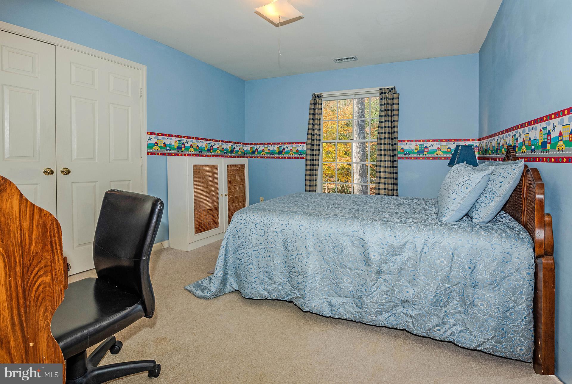 621 Wood Lot Trail Road Annapolis, MD 21401 - Photo 31 of 44 a bedroom with a bed chair and window