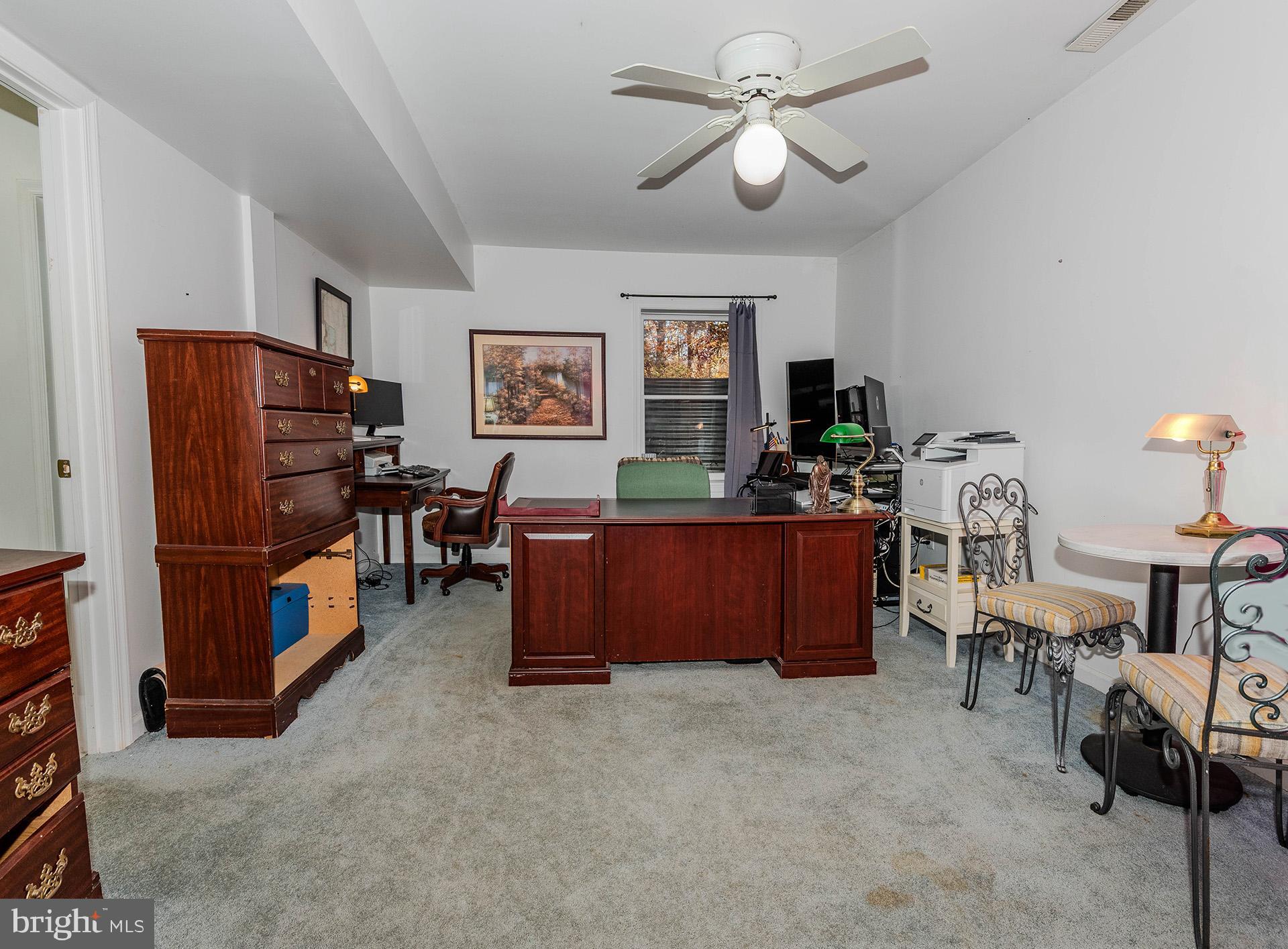 621 Wood Lot Trail Road Annapolis, MD 21401 - Photo 36 of 44 a room with furniture and a flat screen tv