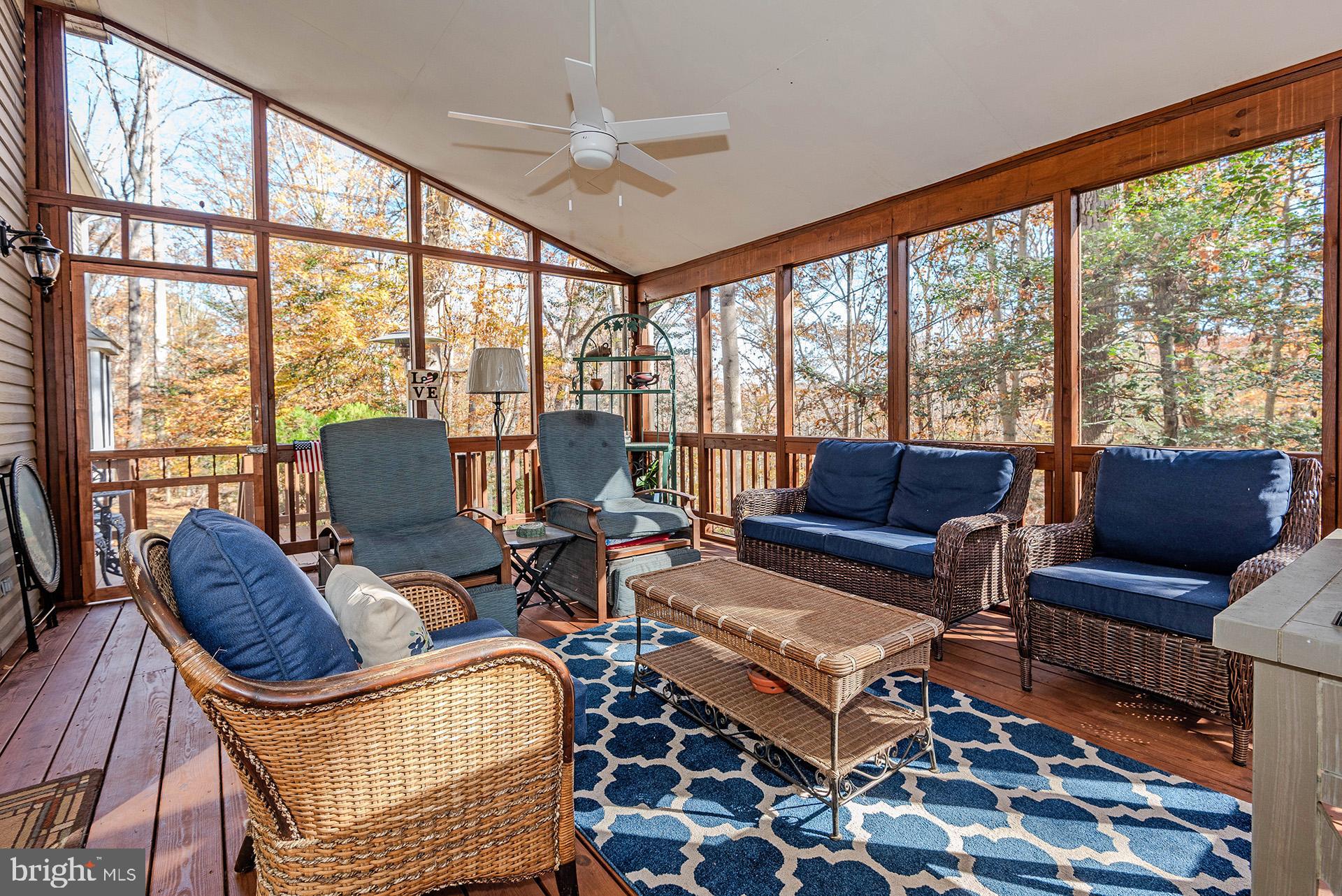 621 Wood Lot Trail Road Annapolis, MD 21401 - Photo 40 of 44 a living room with furniture and a floor to ceiling window