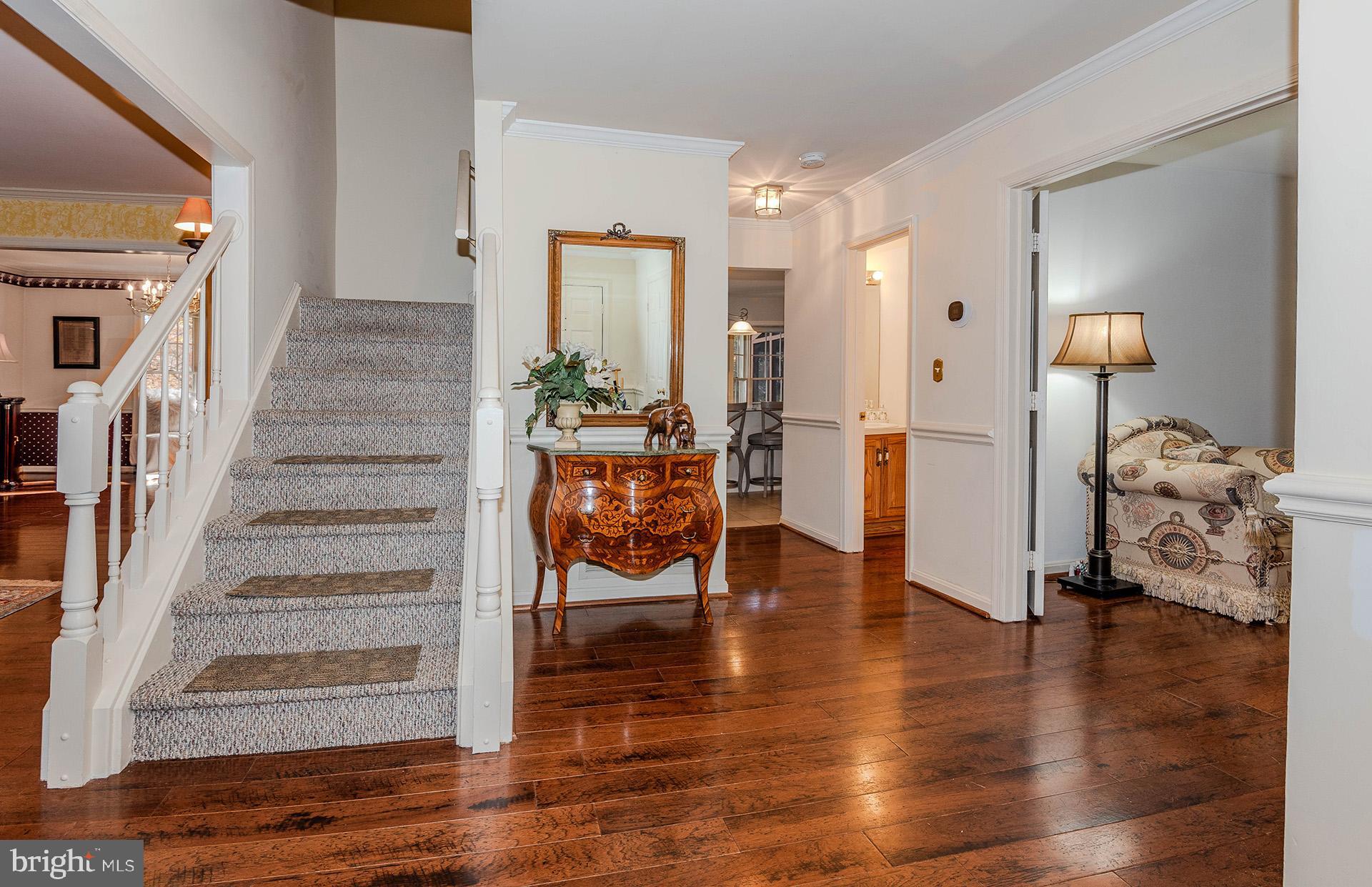 621 Wood Lot Trail Road Annapolis, MD 21401 - Photo 7 of 44 a view of entryway and hall with wooden floor