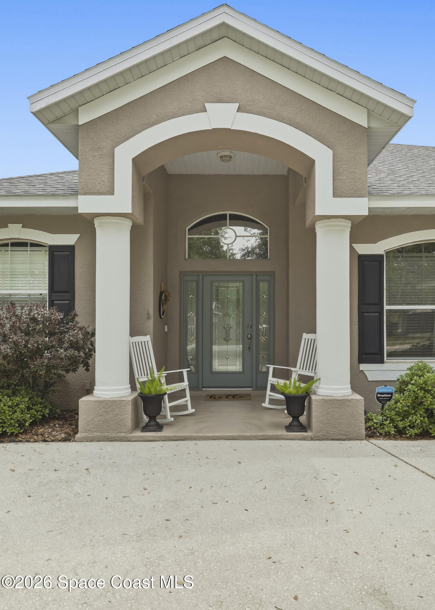 1643 Long Pine Road Melbourne, FL 32940 - Photo 6 of 63 a front view of a house with a porch