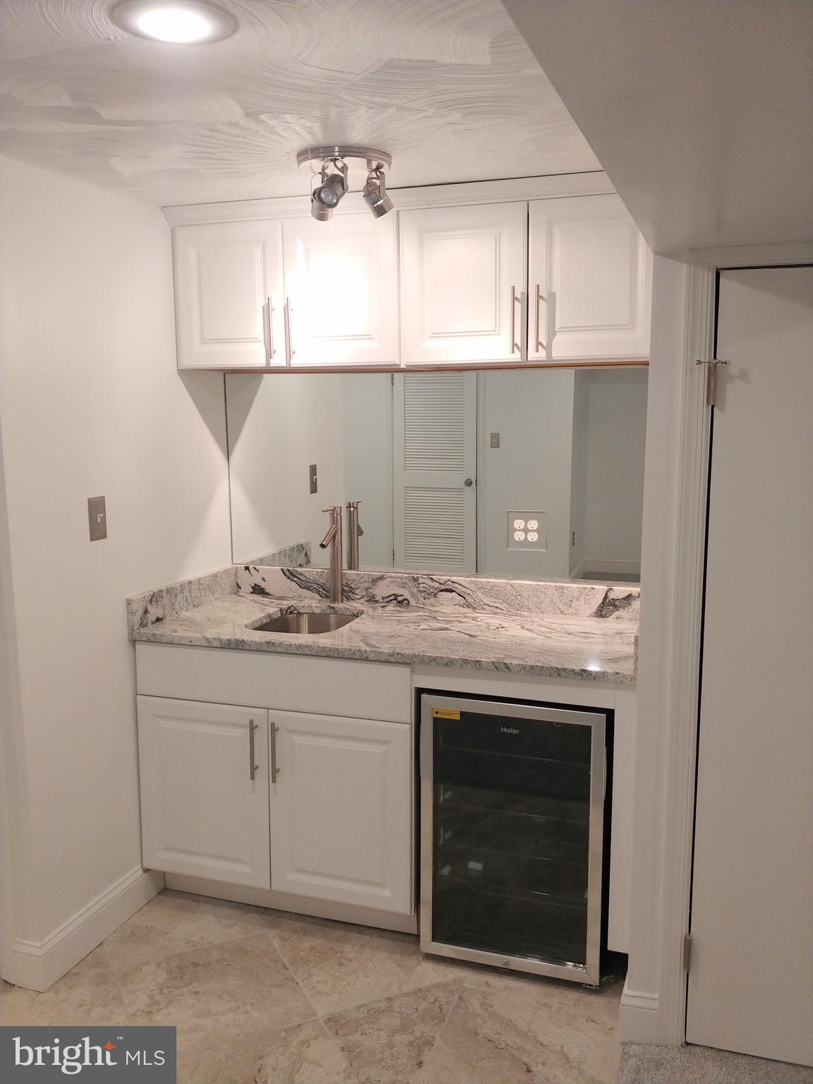 1602 Roundhill Road Baltimore, MD 21218 - Photo 11 of 23 Lower Level Wet Bar w/ Beverage/Wine Cooler
