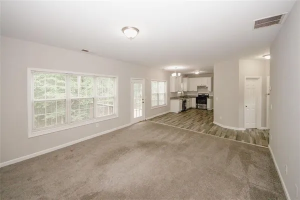 a view of an empty room with a window