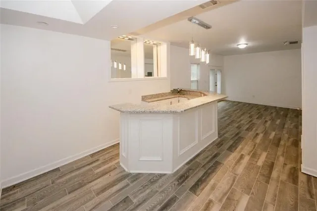 a view of a bathroom with a sink and a mirror