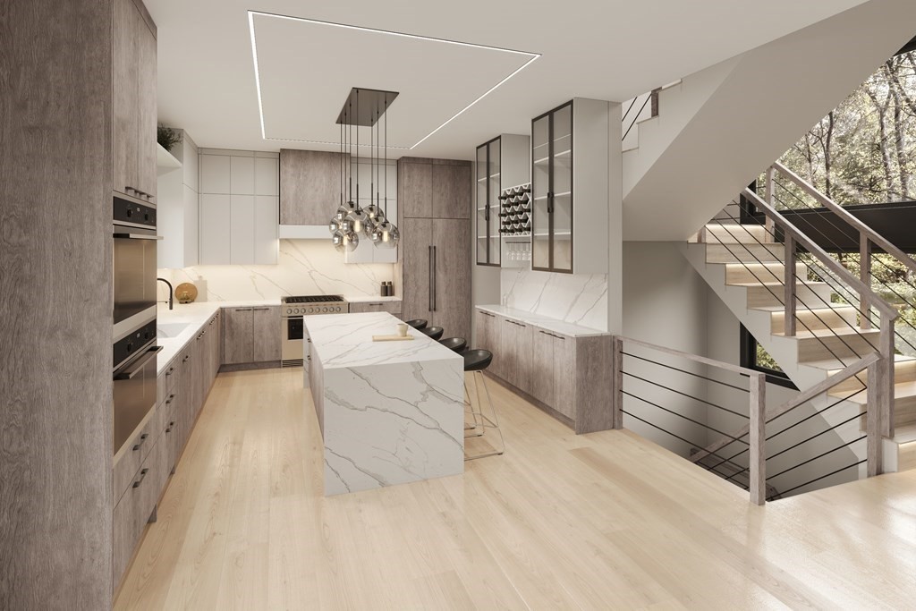 5 Kappius Path Newton, MA 02459 - Photo 4 of 15 a kitchen with stainless steel appliances kitchen island granite countertop a refrigerator and a stove