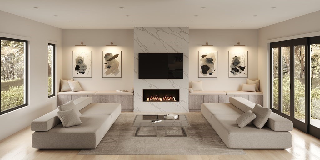 5 Kappius Path Newton, MA 02459 - Photo 6 of 15 a living room with furniture a flat screen tv and a fireplace