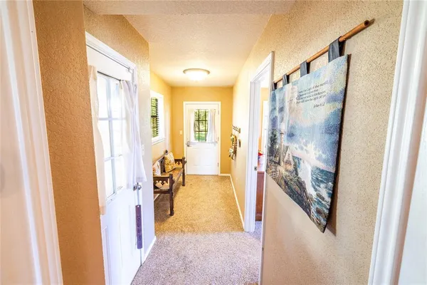 a very nice looking room with a large window and a livingroom