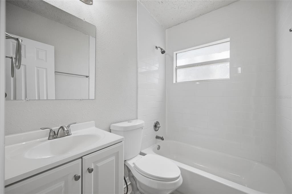 6629 Sierra Terrace New Port Richey, FL 34652 - Photo 14 of 30 a bathroom with a sink toilet and vanity