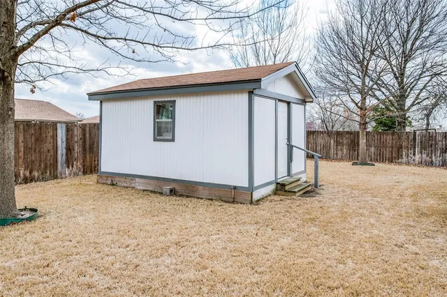 a view of a house with a snow in the yard
