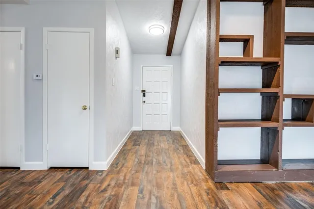 wooden floor in a hall with an entryway