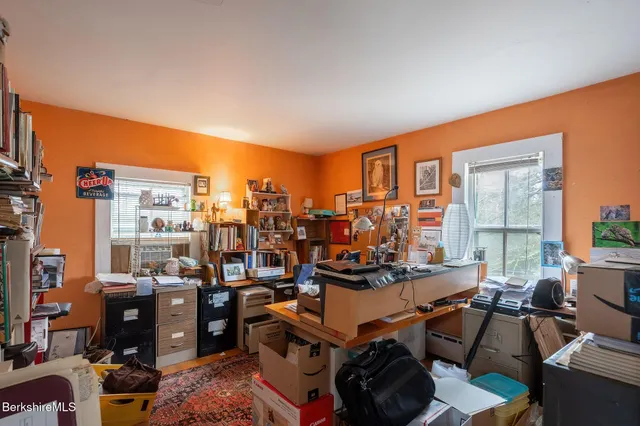 a room with gym equipment and a large window