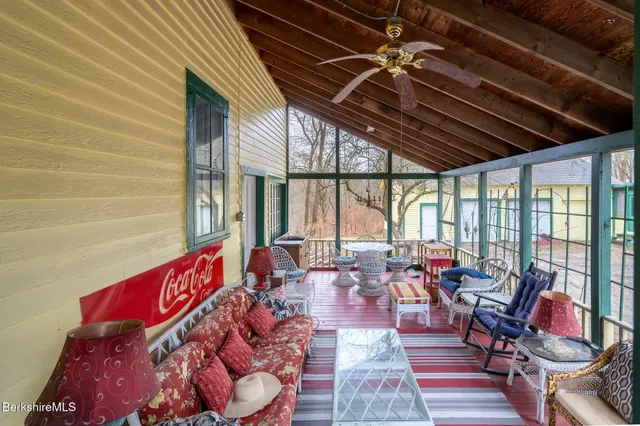 a very nice looking room with lots of furniture and floor to ceiling window