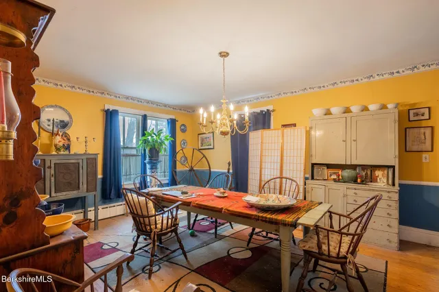 a view of a dinning table and chairs in the patio