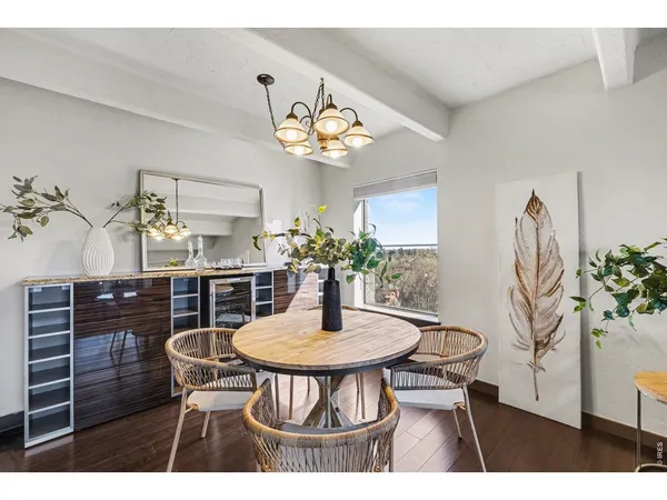 a dining room with furniture and chandelier