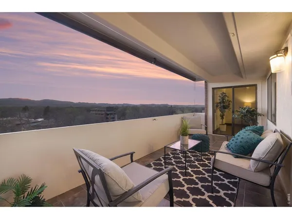 a view of balcony with furniture