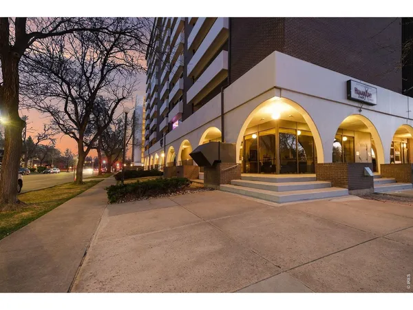 a view of a building with a yard