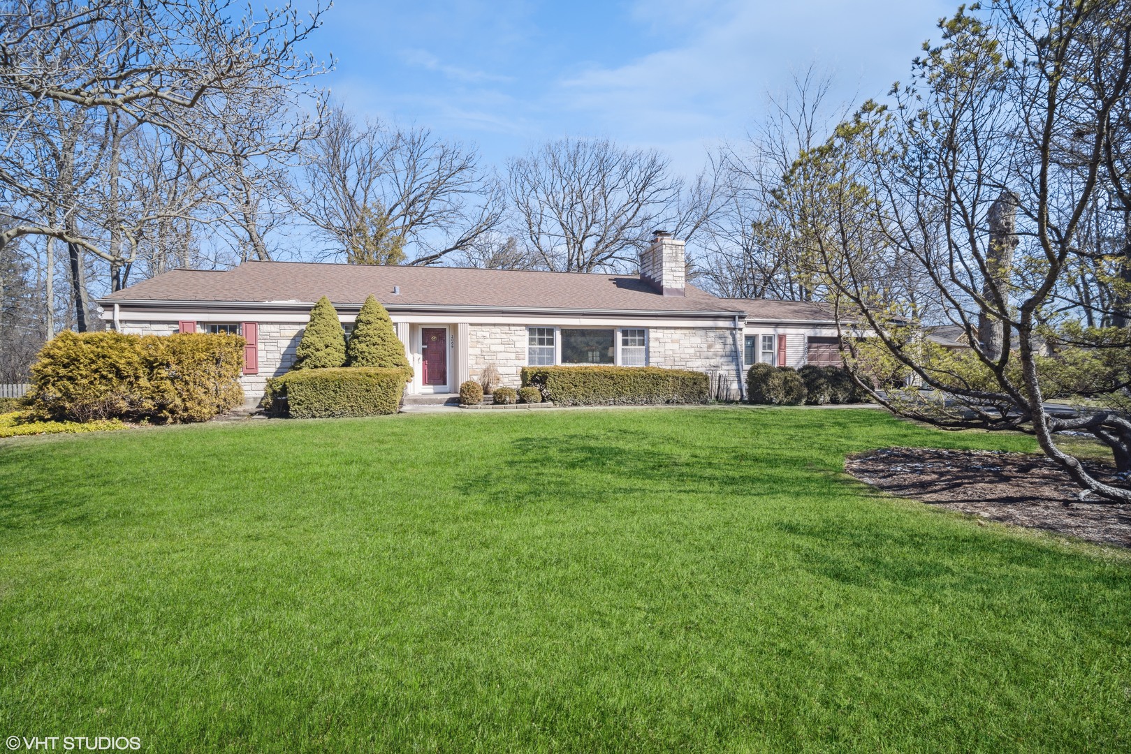 2009 Sunset Ridge Road Glenview, IL 60025 - Photo 1 of 25 a front view of a house with a garden