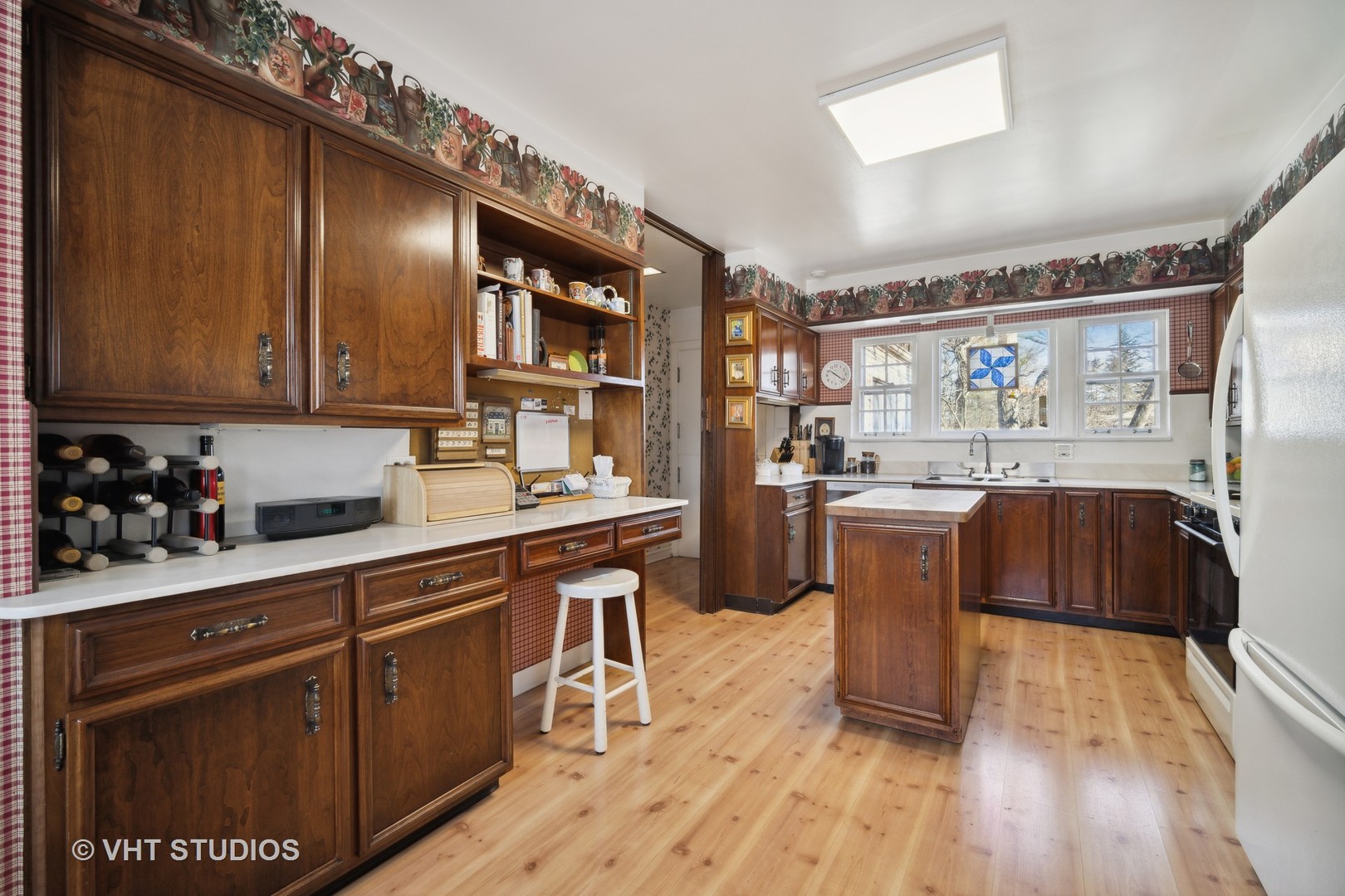 2009 Sunset Ridge Road Glenview, IL 60025 - Photo 15 of 25 a kitchen with a sink cabinets and wooden floor