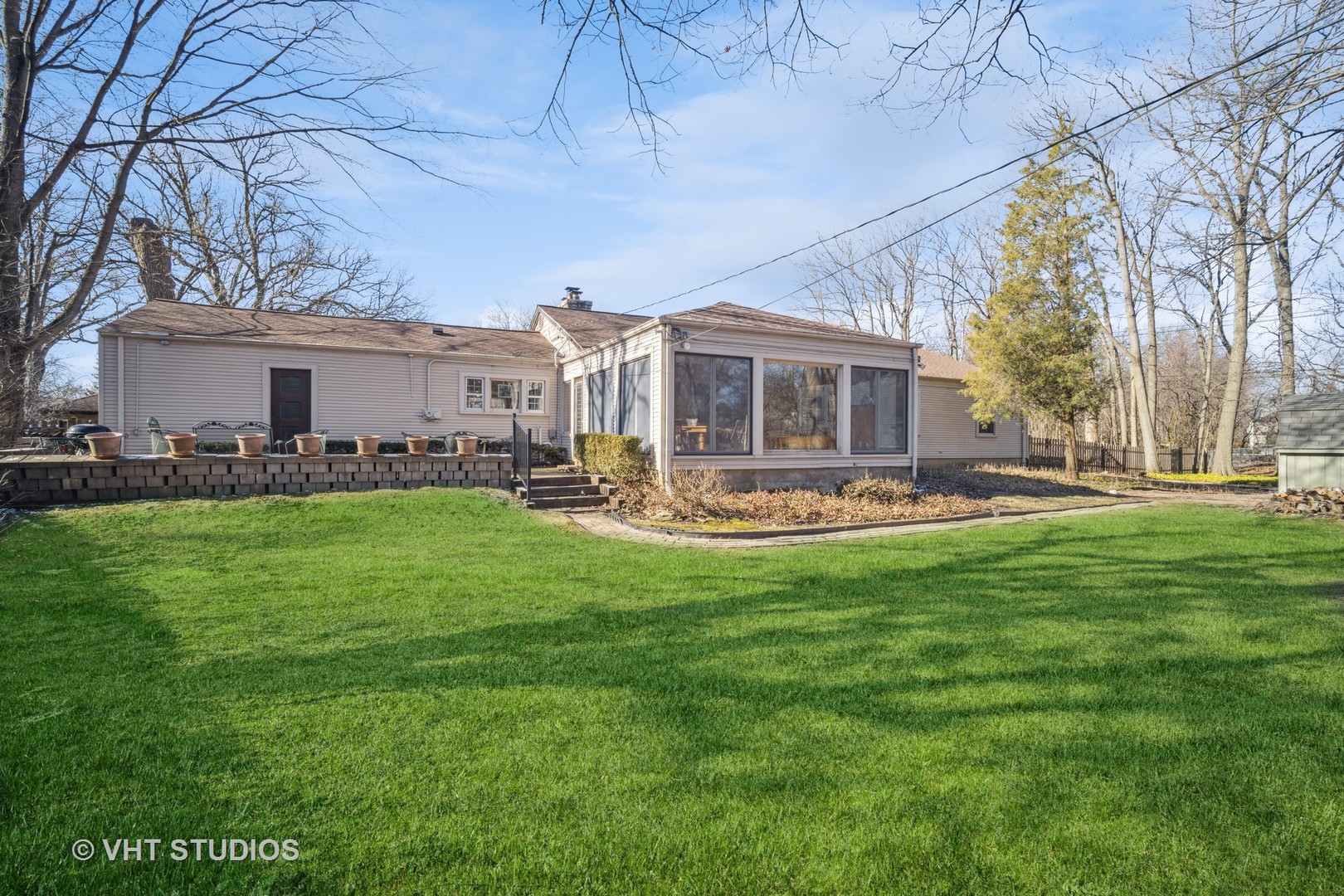 2009 Sunset Ridge Road Glenview, IL 60025 - Photo 3 of 25 a front view of house with yard barbeque and outdoor seating