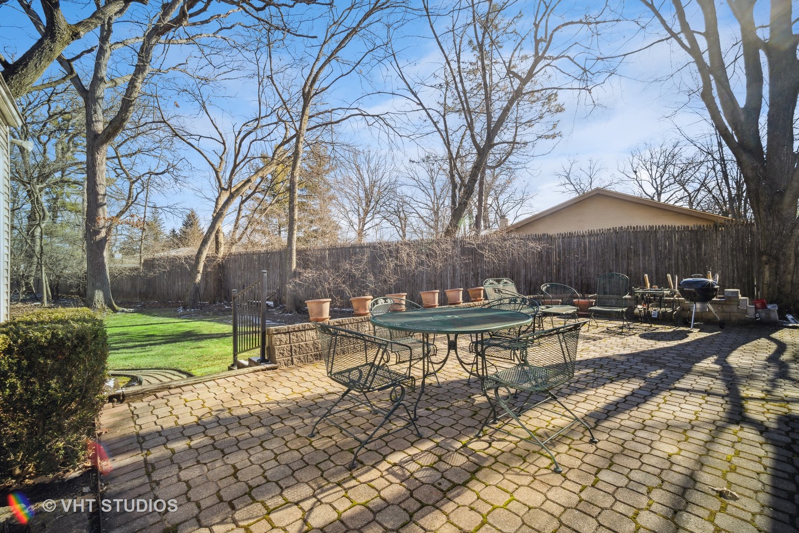 2009 Sunset Ridge Road Glenview, IL 60025 - Photo 5 of 25 a view of a backyard with table and chairs under an umbrella