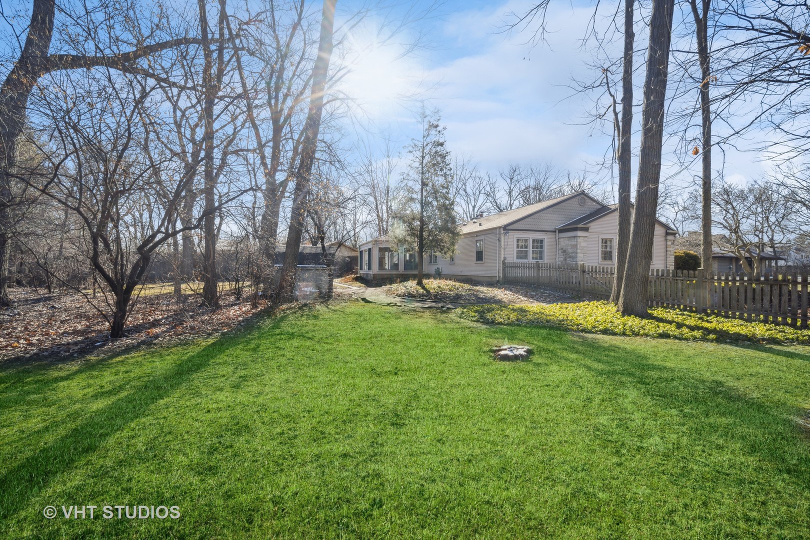 2009 Sunset Ridge Road Glenview, IL 60025 - Photo 6 of 25 a backyard of a house with lots of green space and garden