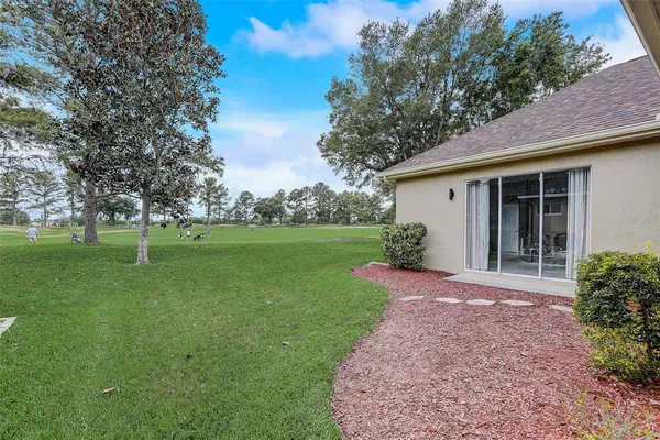 a view of a backyard with a garden
