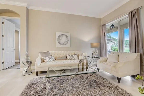 a living room with furniture and a rug