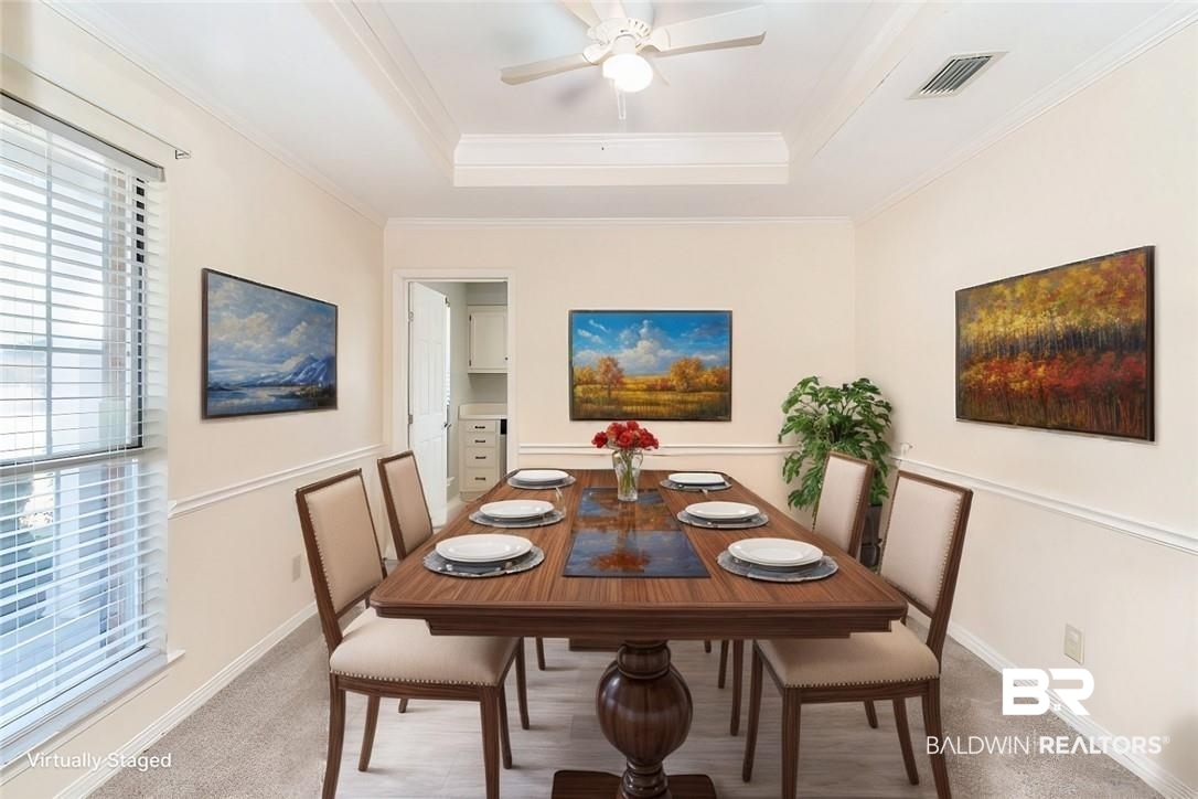 6601 Conde Court Mobile, AL 36695 - Photo 6 of 30 Dining room with a raised ceiling, ceiling fan, crown molding, and carpet flooring