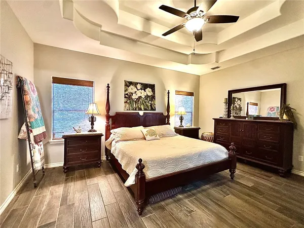 a bedroom with a bed and a dresser