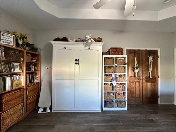 a view of walk in closet with empty racks