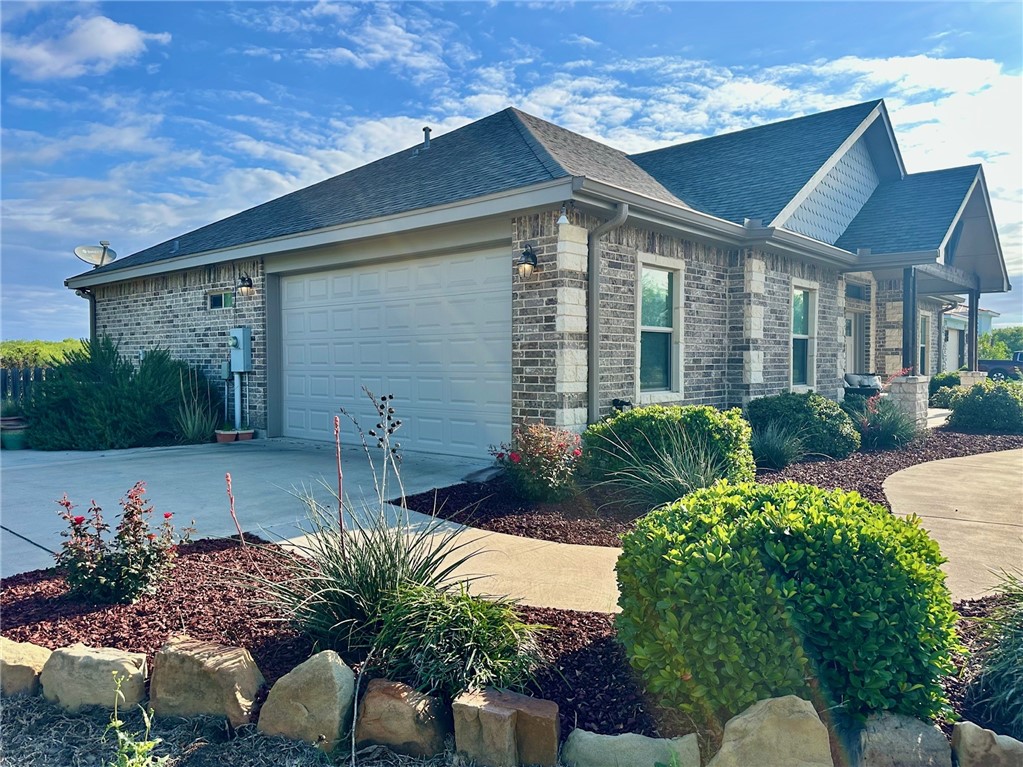 1234 Redfish Drive Riviera, TX 78379 - Photo 25 of 38 Attached 2-car garage. Beautiful landscaping.
