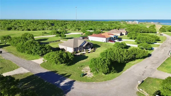 a view of a garden with a house