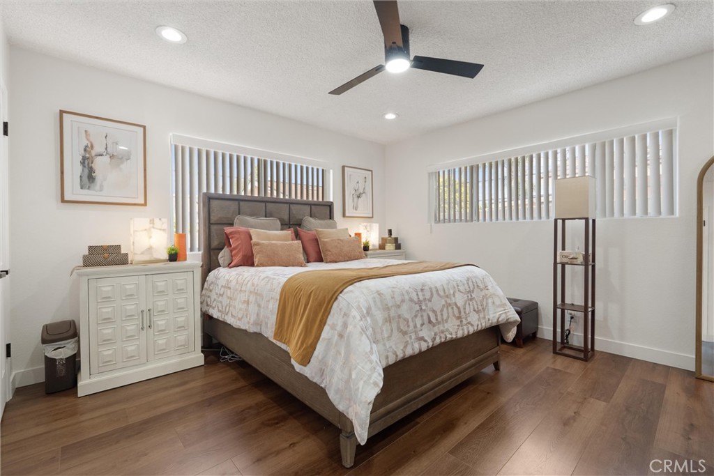 1675 West Mells Lane Anaheim, CA 92802 - Photo 18 of 46 a bed room with a bed and a ceiling fan