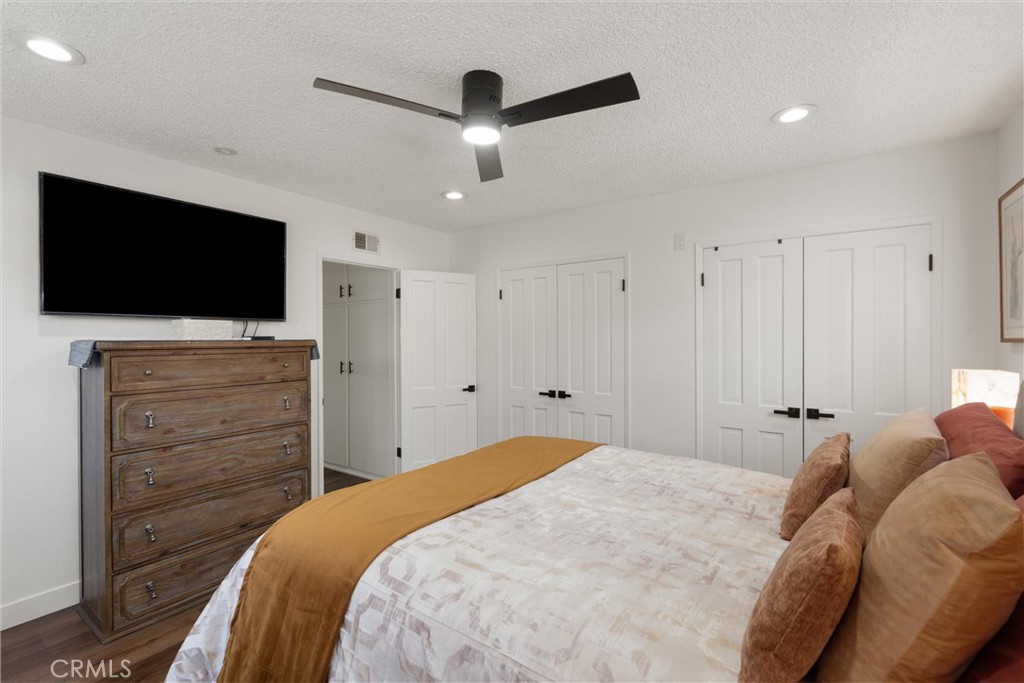 1675 West Mells Lane Anaheim, CA 92802 - Photo 19 of 46 a bedroom with a bed and a flat screen tv