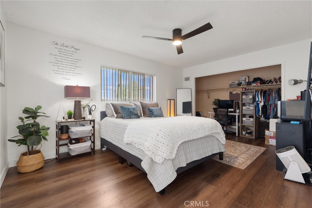 1675 West Mells Lane Anaheim, CA 92802 - Photo 21 of 46 a spacious bedroom with a bed and a potted plant