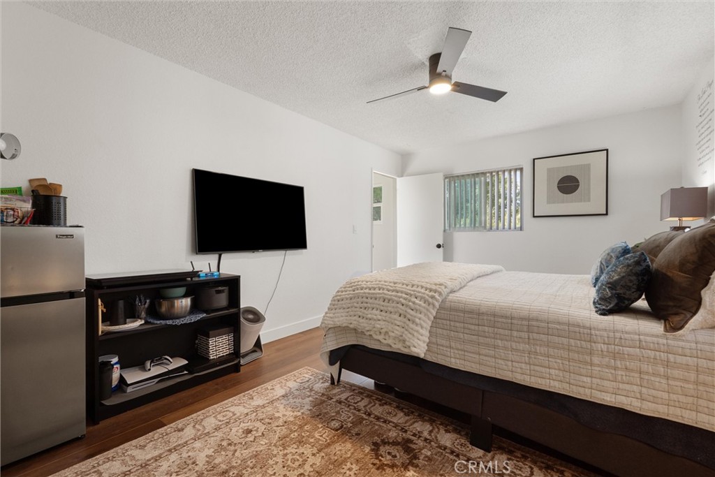 1675 West Mells Lane Anaheim, CA 92802 - Photo 22 of 46 a bedroom with a bed and a flat screen tv