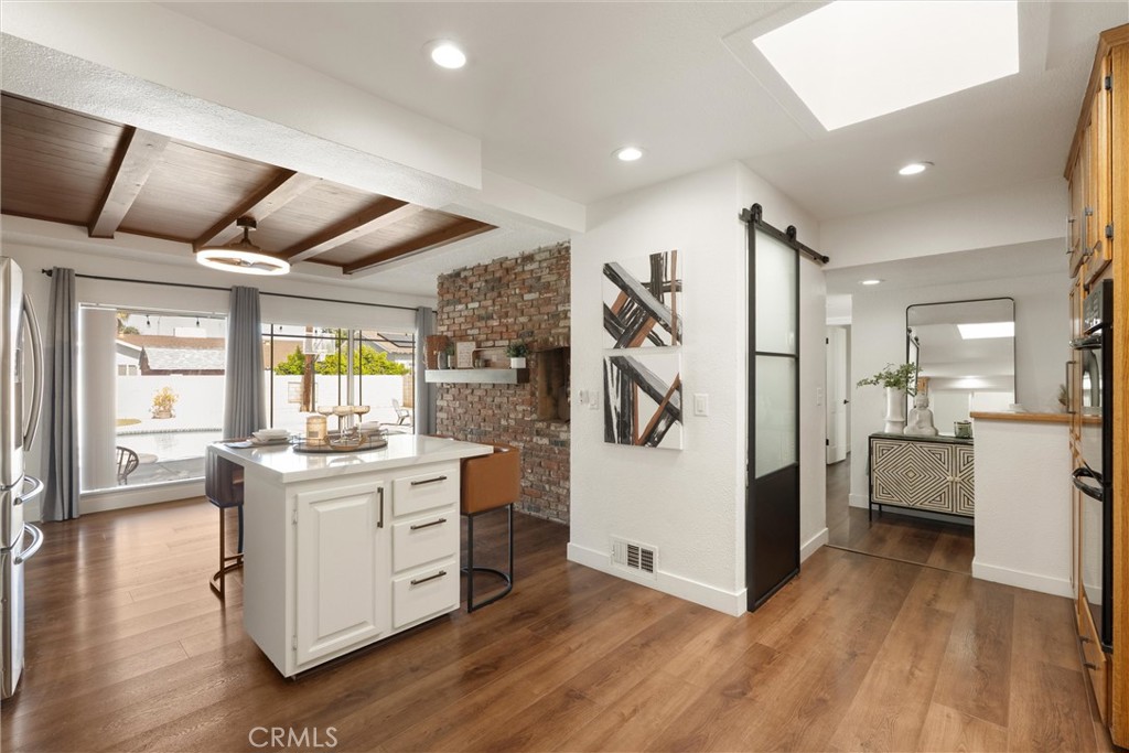 1675 West Mells Lane Anaheim, CA 92802 - Photo 25 of 46 a kitchen with a refrigerator and a stove top oven