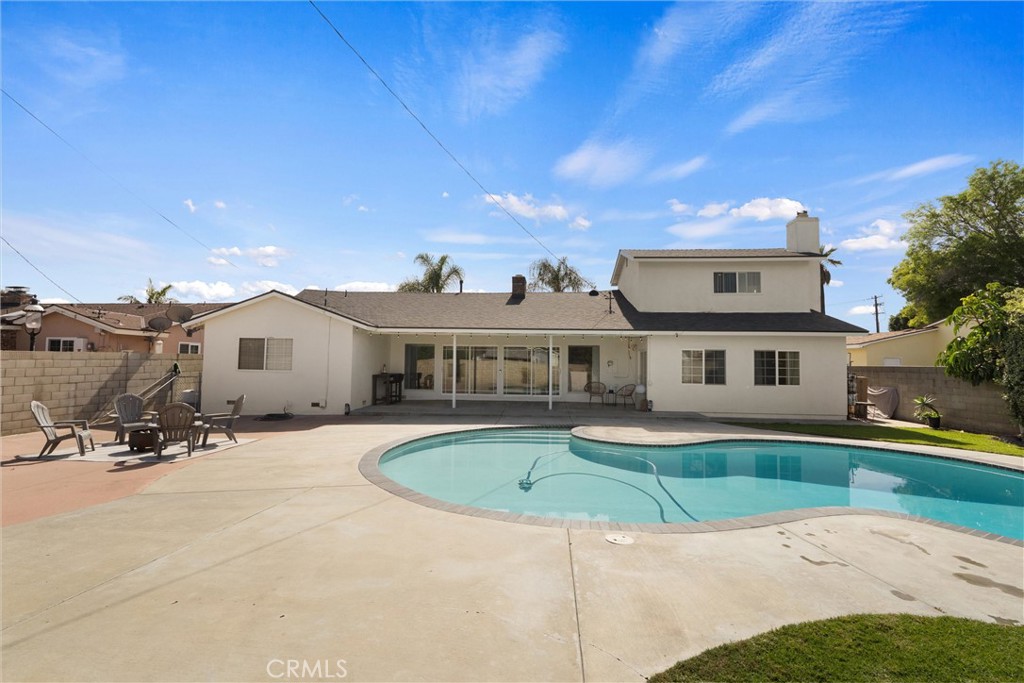 1675 West Mells Lane Anaheim, CA 92802 - Photo 42 of 46 a front view of a house with a yard