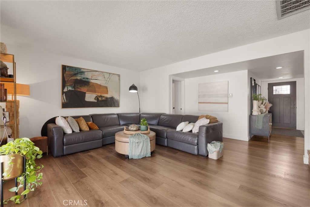1675 West Mells Lane Anaheim, CA 92802 - Photo 8 of 46 a living room with furniture and a wooden floor