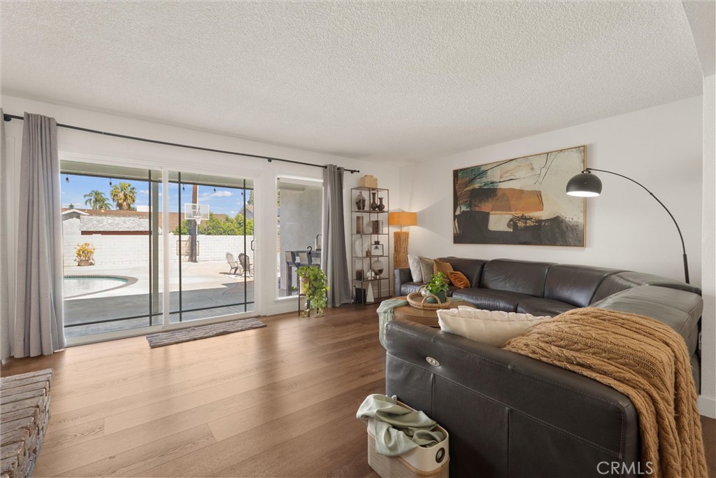 1675 West Mells Lane Anaheim, CA 92802 - Photo 9 of 46 a bedroom with a balcony a bed and a large window