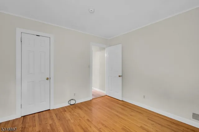 a view of a livingroom with furniture and wooden floor
