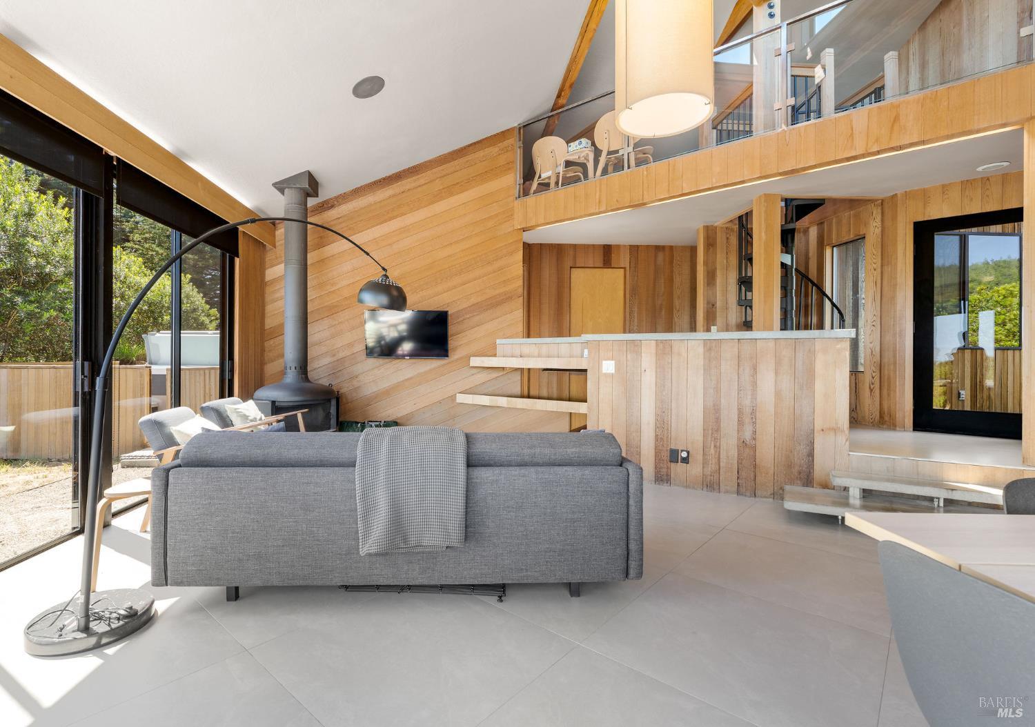 39412 Pacific Reach The Sea Ranch, CA 95497 - Photo 13 of 31 a living room with furniture and a large window