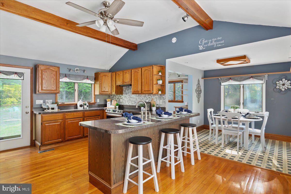 146 Lizzie Mills Road Castleton, VA 22716 - Photo 7 of 91 a view of a dining room with furniture window and wooden floor