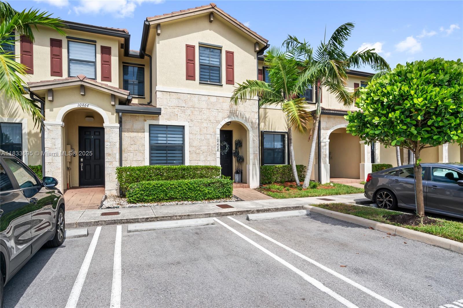 10468 West 33rd Lane Hialeah, FL 33018 - Photo 4 of 77 a front view of a house with a garden