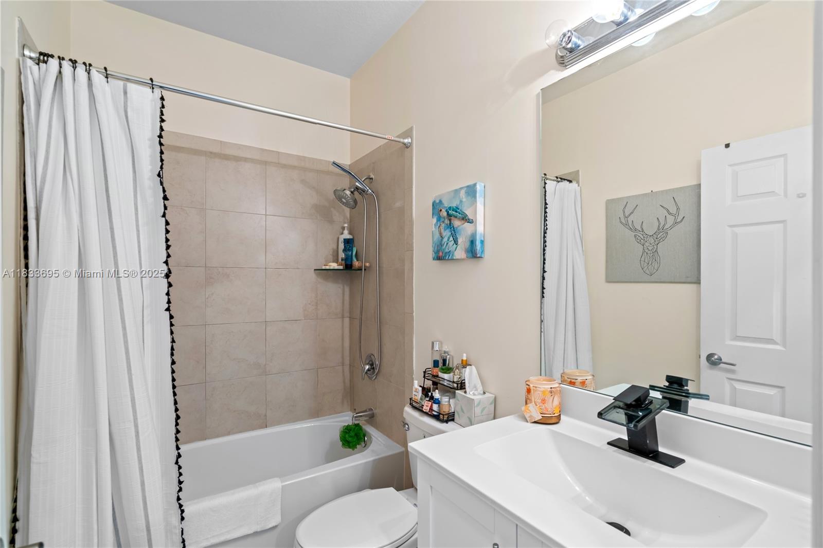 10468 West 33rd Lane Hialeah, FL 33018 - Photo 46 of 77 a bathroom with a sink toilet and shower