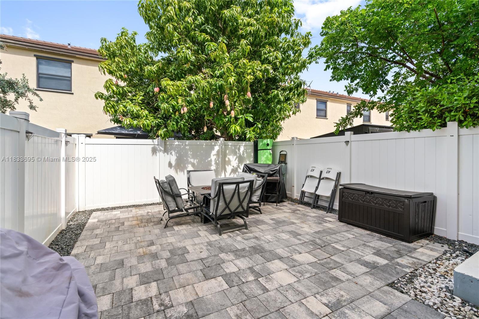 10468 West 33rd Lane Hialeah, FL 33018 - Photo 49 of 77 a view of backyard with outdoor seating and plants