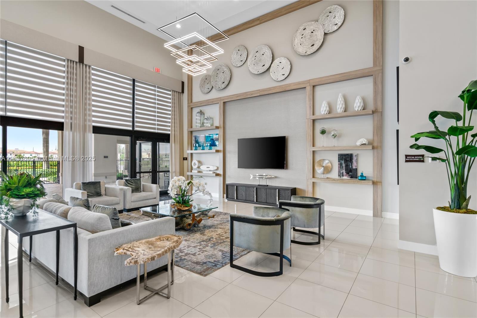 10468 West 33rd Lane Hialeah, FL 33018 - Photo 72 of 77 a living room with furniture a flat screen tv and a large window